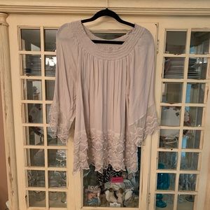 Nude colored top with lace sleeves and bottom
